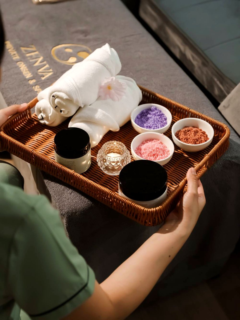 Zenva welcome tray with branded linen and aromatherapy salts